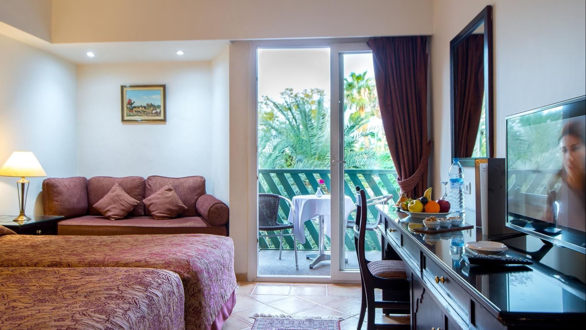 This image shows a beautiful twin-bed room at Hotel Kennedy in Marrakech
